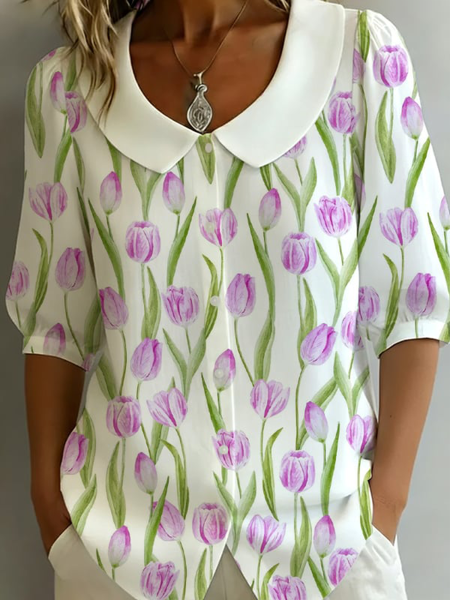 Damesbloes met bloemenmotief, halflange mouwen en popkraag, gemaakt van katoen-linnen mix